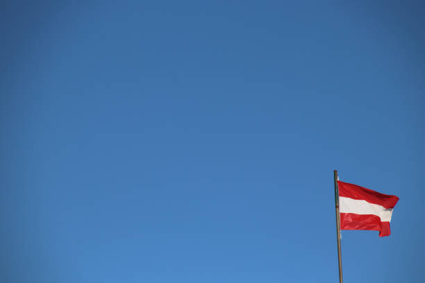 istock Austrian Flag flutters in the Blue Sky 901772778