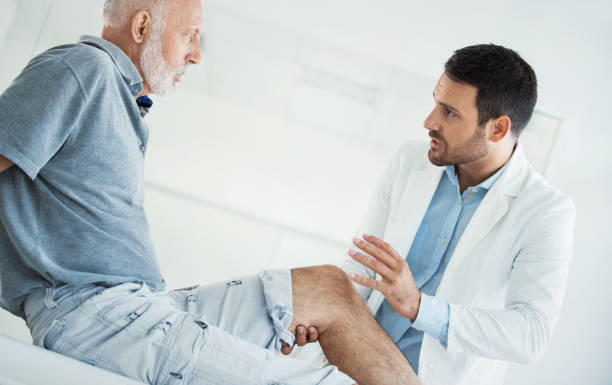 istock Senior man having medical exam. 901776202