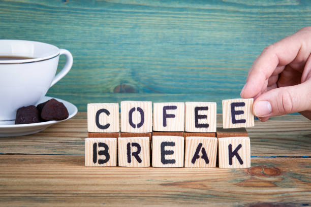 istock cofee break. Wooden letters on the office desk, informative and communication background 901780630