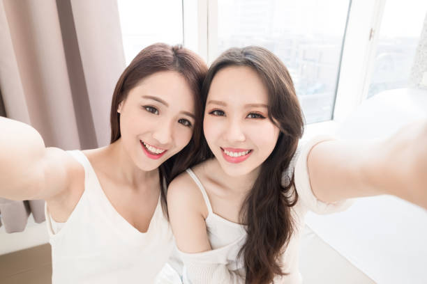 istock two beauty woman selfie happily 901783794