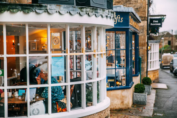 Chipping Camden, UK - December 22nd, 2015: People having afternoon tea at old street in Chipping Camden,England UK.