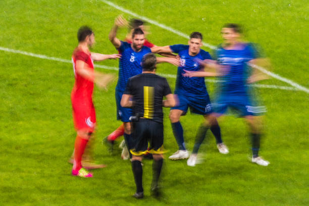istock Referee showing warning players on the field 901787850