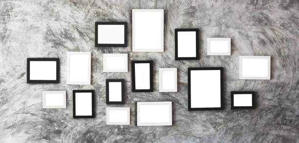istock white isolated picture frames in center of marble wall for user to insert some idea 901788568