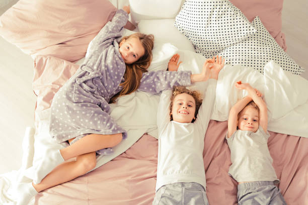 istock Brothers and sister smiling 901789876