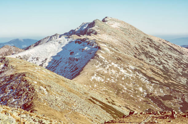 istock Footpath leading up peak Dumbier, Low Tatras, yellow filter 901795934