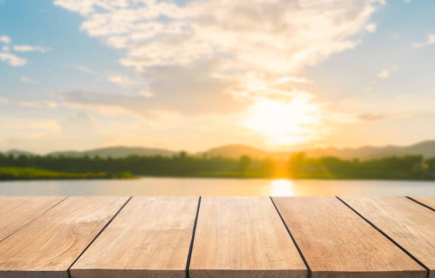 istock Empty wooden table and blur lake view with blue sky 901797748