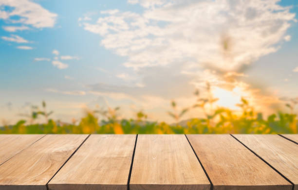 istock Empty wooden table and blur lake view with blue sky 901797770