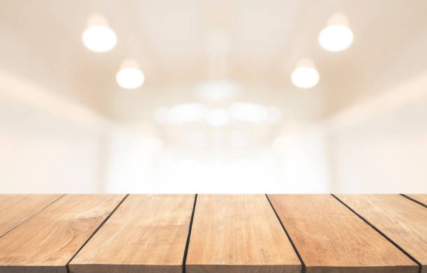 istock Empty wooden table and interior background, product display, blurred light interior background with bokeh 901797854