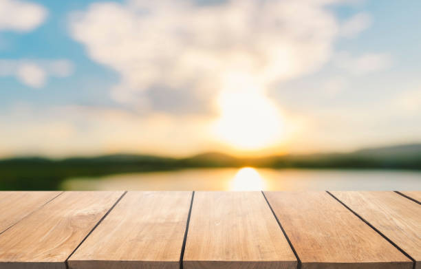 istock Empty wooden table and blur lake view with blue sky 901798052