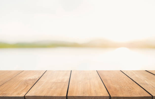 istock Empty wooden table and blur lake view with blue sky 901798094