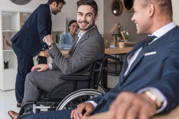 istock smiling disabled businessman in office 901800652