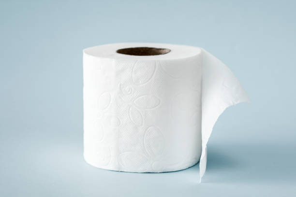 White roll toilet paper on the  light blue background stock photo