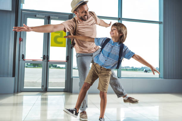 istock father and kid in airport 901813544