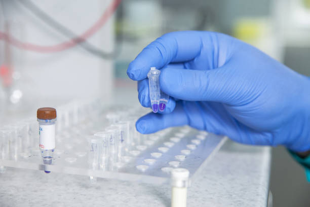 istock scientist or laboratory technician working with dispenser, a centrifuge, test tubes and other laboratory instruments 901813926