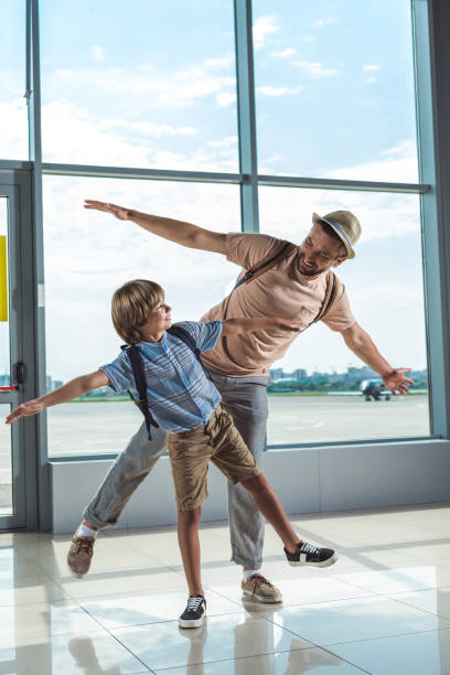 istock father and kid in airport 901813962