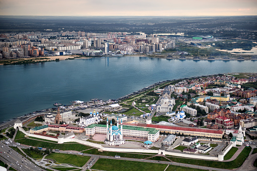 Helicopter point of view of Kazan, capital of Republic of Tatarstan, Russia. Kazan Kremlin and river Kazanka are in main view with Riviera Aquapark and Kazan Arena stadium in the distance.
