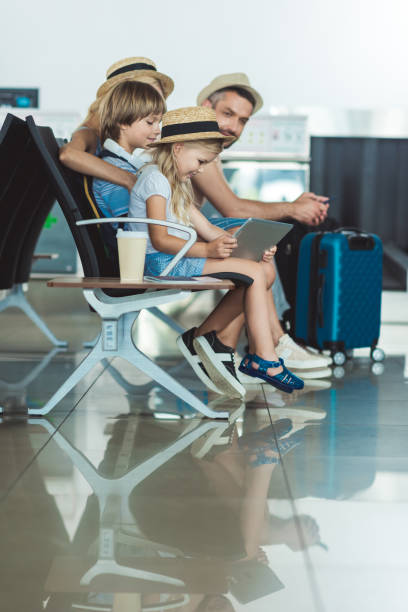 istock kid with tablet at airport 901817498