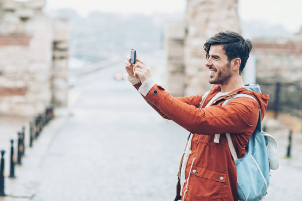 istock Tourist making photos with his smart phone 901821620