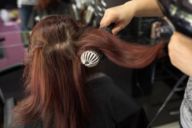 istock Professional hairdresser using hairdryer 901825622