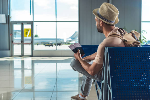 istock traveler with passports and tickets 901825782