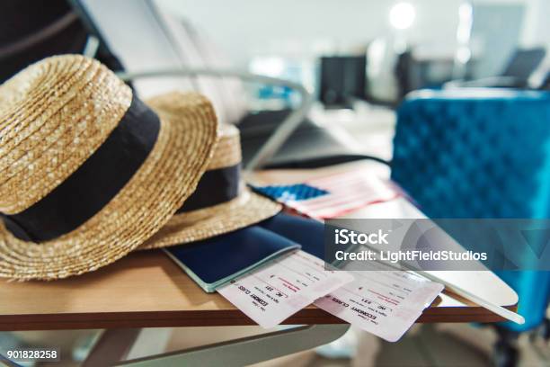 Traveling Equipment On Chair At Airport Stock Photo - Download Image Now - Airplane Ticket, Airport, American Culture