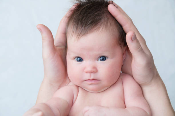 istock Infant baby in fathers hands, happy child 901828536
