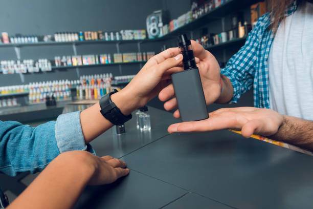 The girl came to the vapeshop. stock photo