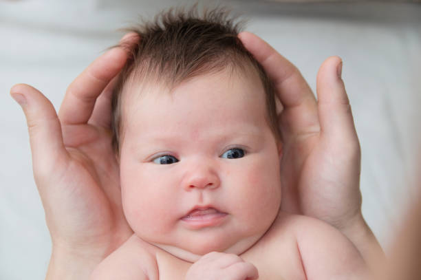 istock Infant baby in fathers hands, happy child 901829292