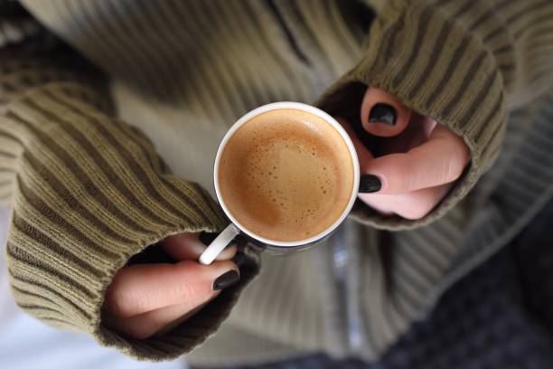 istock Midsection Of Woman Having Coffee 901829840