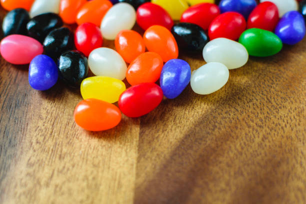 istock Candy background. Easter background on wood table.  Bright, colorful jelly beans. 901841812
