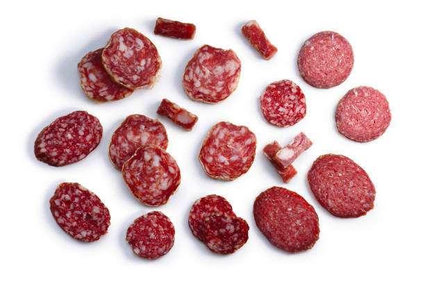 Sliced salami sausages,top, paths Salami, a dried fermented cured sausage slices, top view. Clipping paths, shadow separated sliced salami stock pictures, royalty-free photos & images