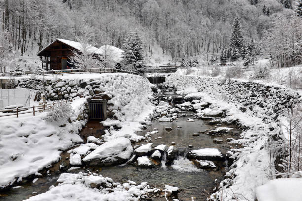istock winter landscape in the Alps with the river and clouds 901847816