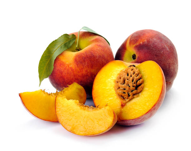 istock Fresh peach with green leaf isolated on white background. Peach in a cut 901850070
