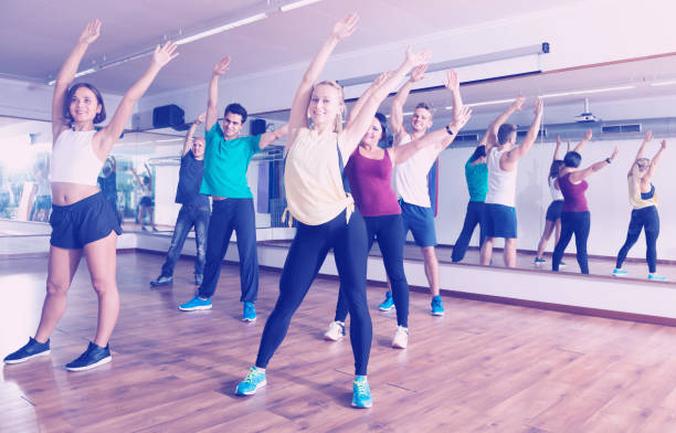 istock Laughing positive people learning zumba steps 901850300