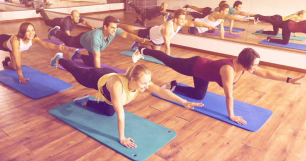 istock People relaxing and enjoying yoga 901850322