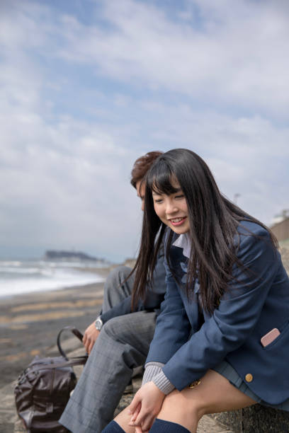 istock High school student couple dating at beach 901854424