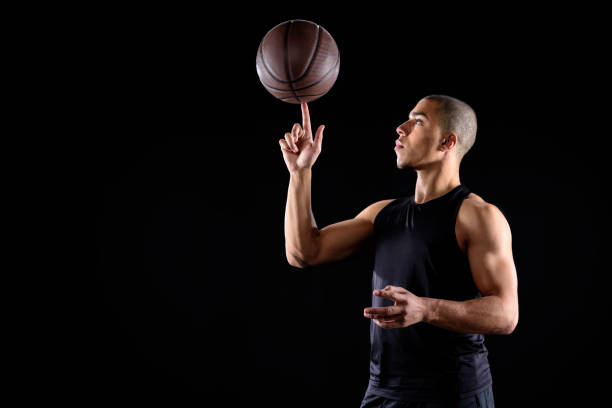 basketball player shooting the ball on white background