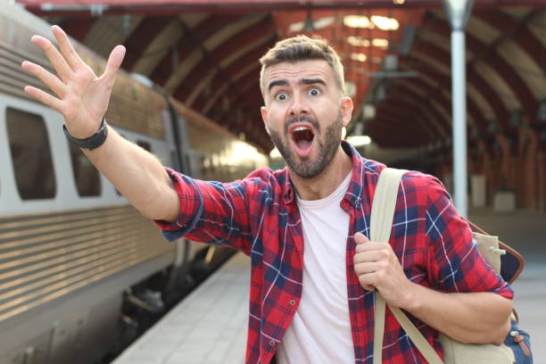 Man screaming after losing his train stock photo