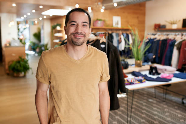 istock Smiling young Hispanic man standing in a clothes shop 901863426