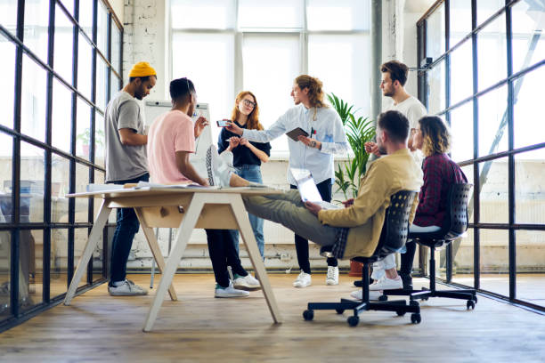 istock Talented male and female graphic designers having discussion about starting project developing successful strategy planning working in friendly atmosphere, dream team having brainstorming session 901863516