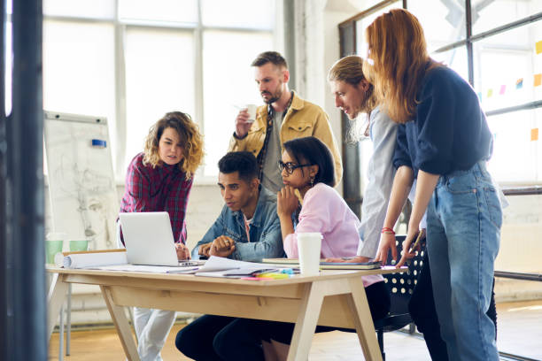 istock Group of serious team members closely reading useful information via modern device and 4G connection while planning working strategy,crew of students preparing for examination using technology 901863554