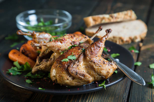 istock Fried quail with carrots and fresh parsley 901864066