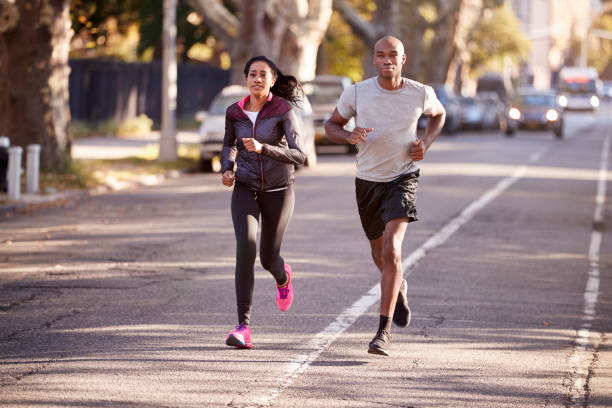 istock Young black couple jogging in a Brooklyn street 901870868