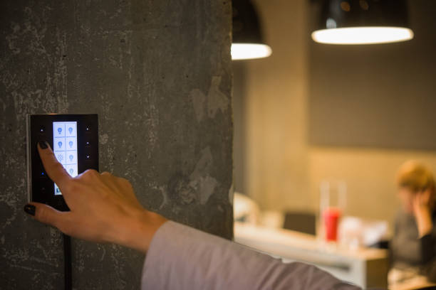girl adjusts the lighting in the room with a touch switch