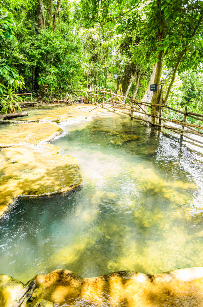 istock up stream of kuang si waterfall 901894810