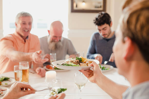 istock Passing A Plate At The Dinner Party 901895586