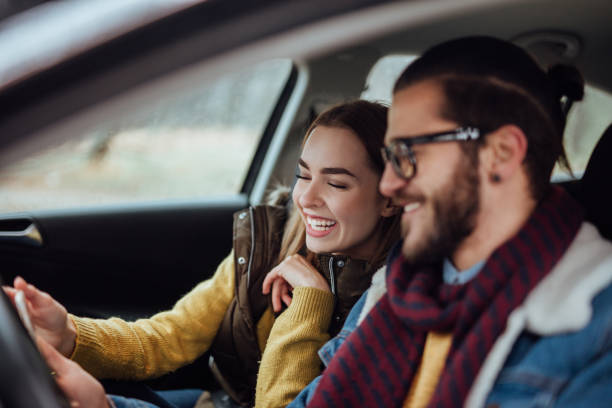 istock Young happy couple going on a road trip during winter day. 901907316