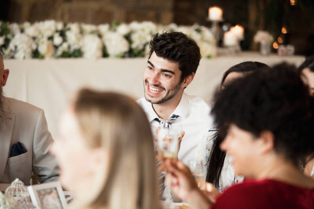 istock Wedding Guests Socialising At Dinner 901908038