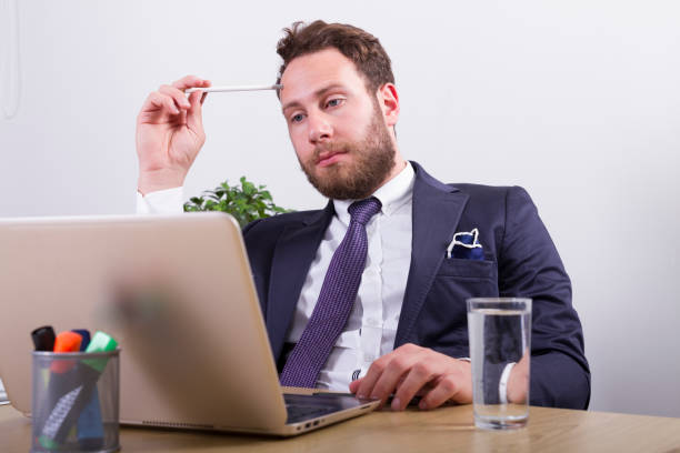 istock Puzzled businessman in office 901911860