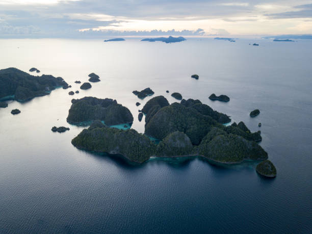 istock Remote Limestone Islands in Raja Ampat at Dusk 901915986
